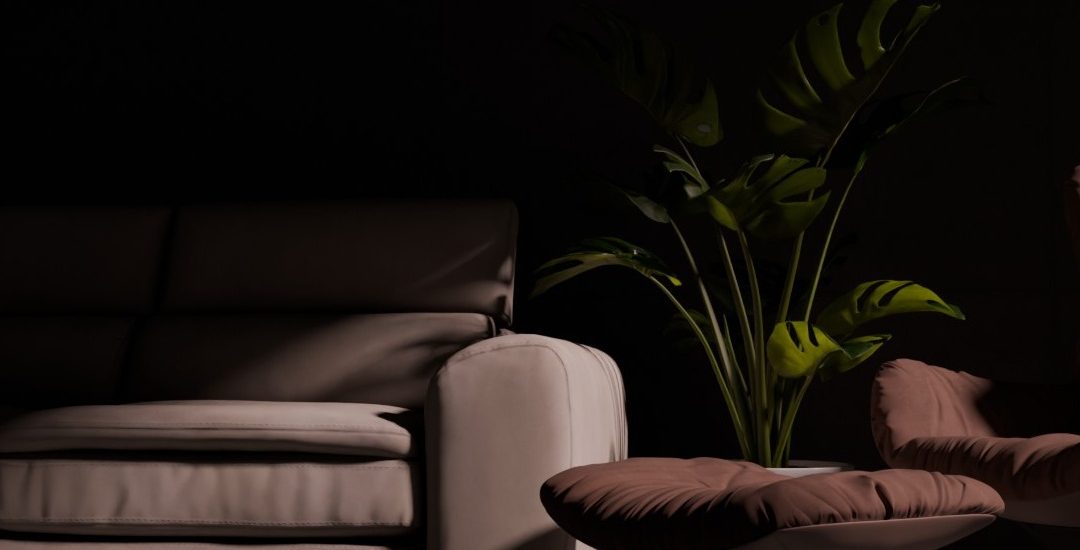 Moody 3D interior scene with modern sofa, armchair, ottoman and plant, lit with soft cinematic lighting against a dark background
